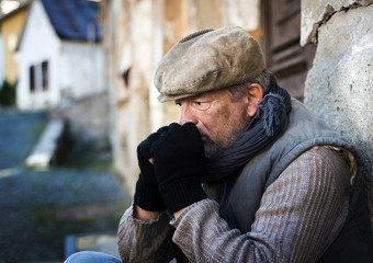 Homeless man in the street is being cold