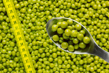Fototapeta na wymiar Spoon of Green Peas