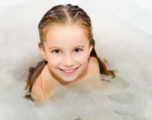 Little girl is taking a bath