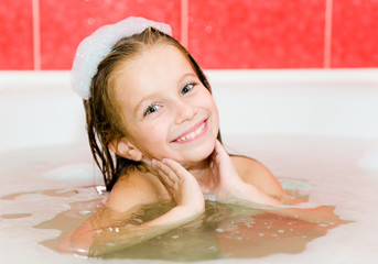 Little girl is taking a bath
