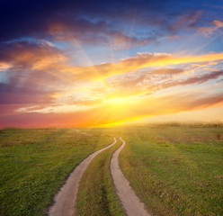 path in steppe to sunset