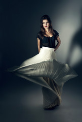 Fototapeta premium attractive woman in flying white skirt