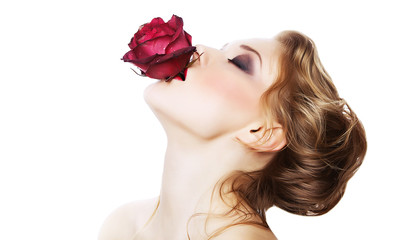 sensual woman with rose in mouth