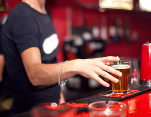 Barman making shoot cocktail at the night club
