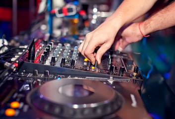 Dj mixing in night club