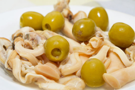 navajas, spanish jackknife clams, served as appetizer with olive