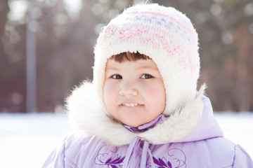 Portrait of  little girl in hat, winter