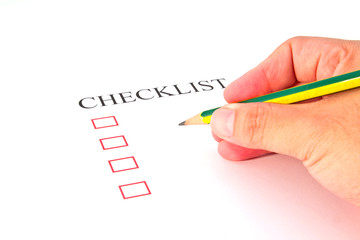 Checklist with pencil and checked boxes.