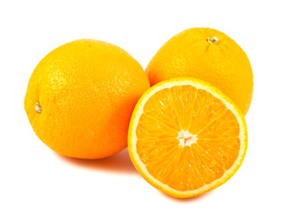 Sliced and whole orange fruits