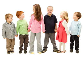 Group of happy kids holding hands
