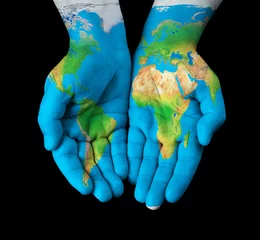 Rolgordijnen Map painted on hands showing concept - the world in our hands © chones