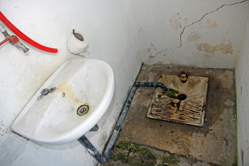 abandoned hygienic service in a dilapidated train station