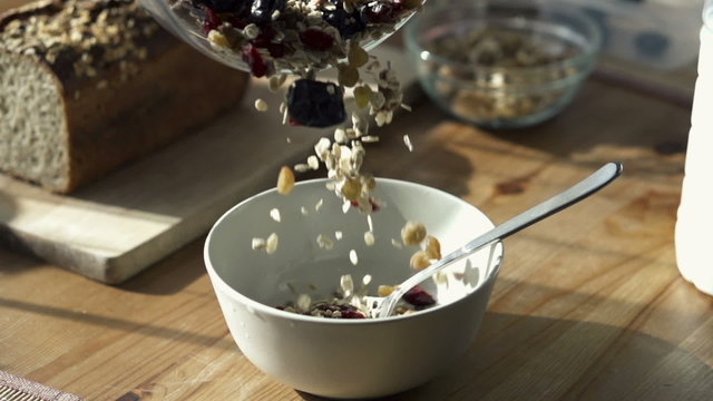 Pouring muesli into bowl, slow motion shot at 240fps