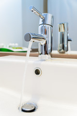 The stream of water from a tap