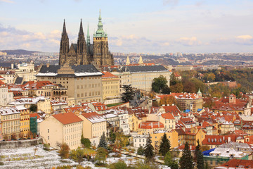 Fototapeta na wymiar Snowy colorful autumn Prague gothic Castle, Czech Republic