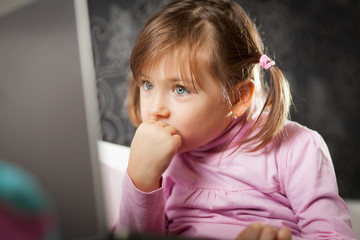 Girl looking at laptop screen