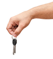 Male hand holding keys isolated