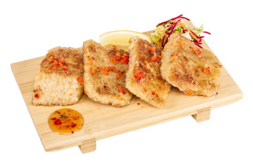 Fried fish fillets with  salad.