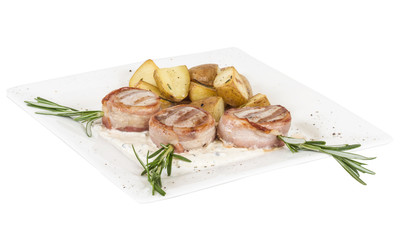 Grilled steak wrapped in bacon, with grilled vegetables, mashed