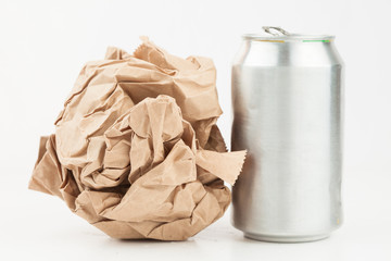 Empty can and crushed paper bag