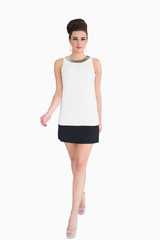 Woman in white dress walking