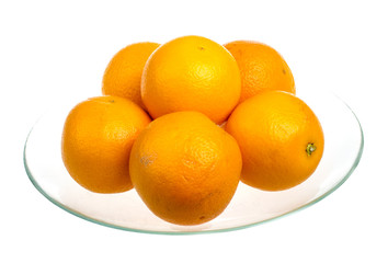 Heap of oranges in the dish