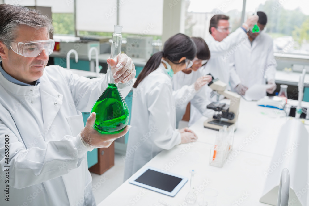 Poster chemists working in a laboratory