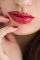 Fototapeta premium Close-up of woman showing her red lips