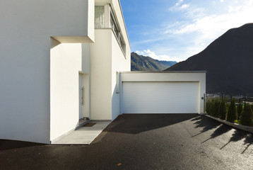 modern house white, view from the courtyard with garage