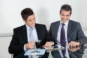 Fototapeta premium Businessmen Using Digital Tablet In Office