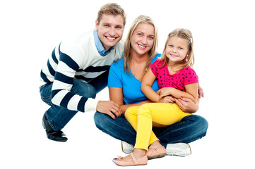 Portrait of happy couple smiling with cute daughter