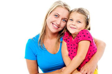 Adorable mom and daughter posing together