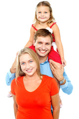 Portrait of cheerful family of three having fun