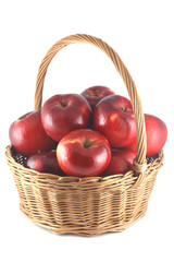 red apples in a wicker basket