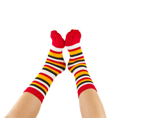 female legs in colorful striped socks