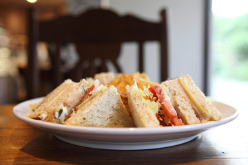 Club sandwich with on wood background