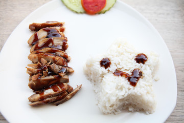 Grilled Chicken teriyaki rice on wood background