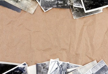 Frame made of old photos crumpled packaging brown paper backgrou