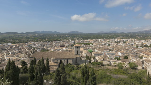 Time lapse view over the city of Arta with clouds passing by