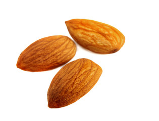Three peeled almond seeds
