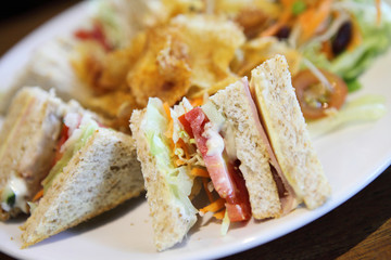 Club sandwich with on wood background