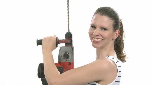 Young craftswoman with a power drill