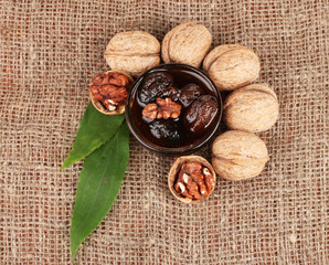 jam walnuts in a bowl on sacking
