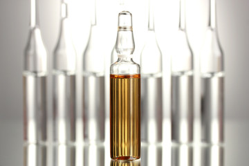 medical ampules on grey background