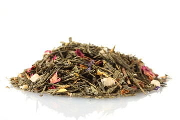 aromatic green dry tea with fruits and petals, isolated on
