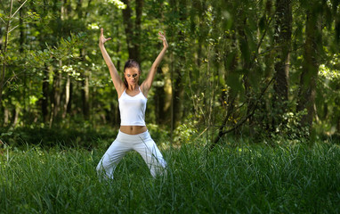 girl practising yoga in nature