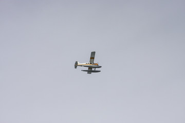 Yellow and White Seaplane on Blue Sky