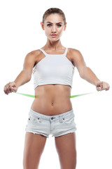 Woman in perfect shape with  green measure  doing  yoga poses. C