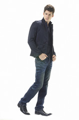 Naklejka premium Portrait of handsome young man in casual standing