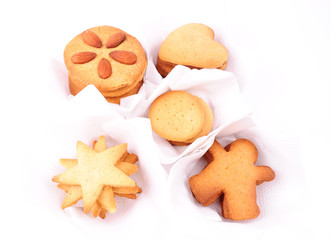 Christmas biscuits in white individual cases, isolated on white
